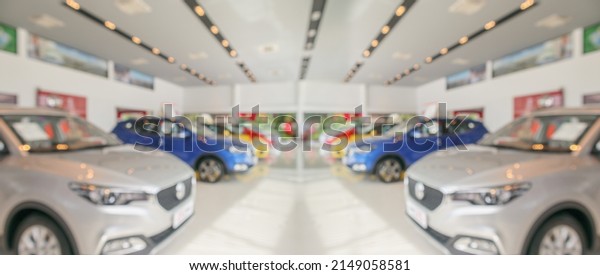 new\
cars in showroom interior blurred abstract\
background