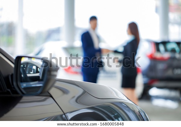 New cars in the\
showroom, sell cars, customers pick up cars, deliver keys, big\
gifts, service staff\
concepts