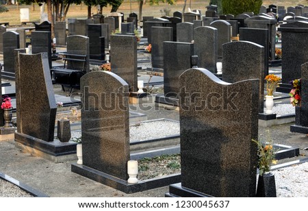 New cemetery alley with marble tombs in row