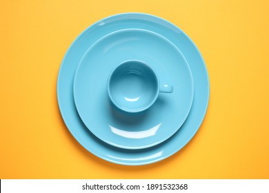 New Ceramic Dishware On Yellow Background, Top View