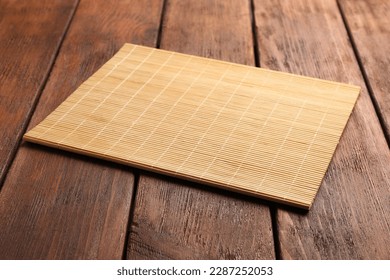 New clean bamboo mat on wooden table