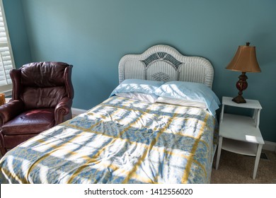 New Clean Bed With Table And Lamp Vintage Beach Theme Blue Green Pillows In Bedroom In House Or Apartment By Red Leather Couch