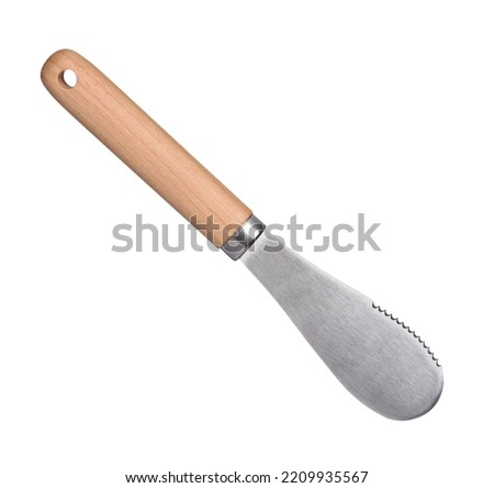 New clean butter knife with wooden handle isolated on white background. Steel dinner butter spreader.