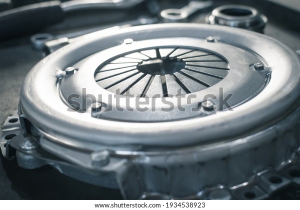new clutch basket in a car service\
before installation on a car. Close up. Blur\
effect.