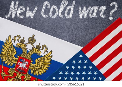 New Cold War Text Written On Chalkboard, Flags Of USA And Russia  