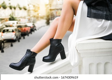 a new collection of women's shoes autumn winter '20 / 21. The girl bought new shoes. Legs in boots.