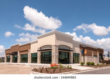 New Commercial, Retail and Office building Space available for sale or lease in mixed use Storefront and office building with awning - Shutterstock ID 144849883