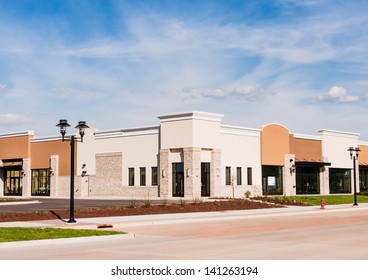 New Commercial, Retail And Office Space Available For Sale Or Lease. Strip Mall. Modern Commercial Office Building.