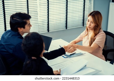 A new and competent female employee successfully interviewed. Newly graduated gets her first job after the interview. - Shutterstock ID 2231448313