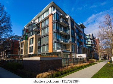 New Concrete Low Rise Apartment Building On Sunny Day.