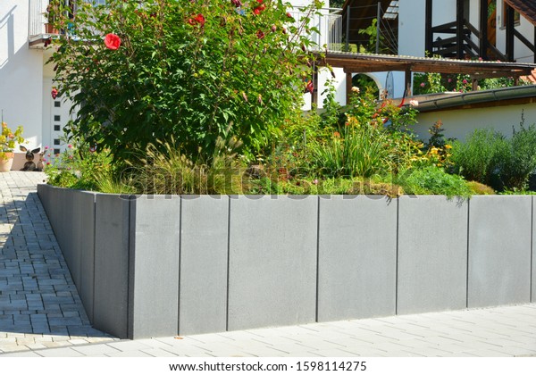 New Concrete Wall at the Driveway of a multi\
Family Residential Building