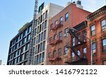 New Condo Development Bowery Street New York City Gentrification of Old Neighborhood Immigrant Tenement Apartments