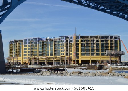 New construction in downtown Cleveland, Ohio Flats East Bank multi use apartment building on frozen Lake Erie under bridge. Stock photo © 