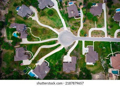 New Construction Homes And Houses Above Suburb Living In A New Build Community With A Cul De Sac Circle And Driveways Leading Into Luxury Large Mansion Homes Outside Of Austin , Texas , USA 