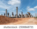 New construction site with mechanical equipments, Concrete bridge pillars of the bridge in China high speed train from Bangkok to Nakhon Ratchasima, Train construction industry.