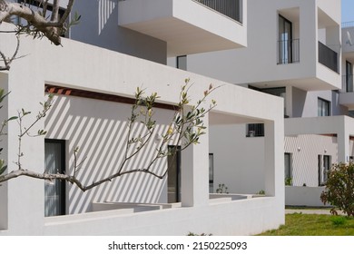 New Contemporary Residential Construction Architecture Background. White Modern House Facade Exterior