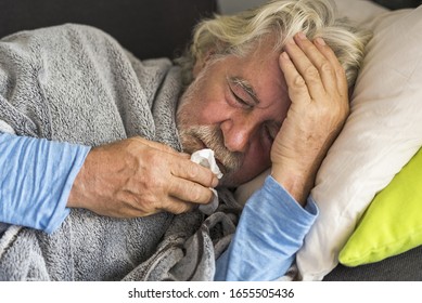 New Coronavirus CoVid-19 Outbreak Situation With Pandemic Epidemic Warning - Adult Caucasian Senior Old Man With Fever Symptoms Like Illness Cold Seasonal Influenza - People And Virus Concept