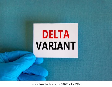 New covid-19 delta variant strain symbol. Doctor hand in blue glove with white card. Concept words 'delta variant'. Medical and COVID-19 delta variant strain concept. Copy space.