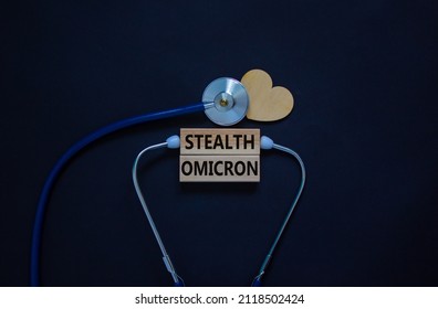 New Covid-19 Stealth Omicron Variant Strain Symbol. White Card, Words Stealth Omicron, Stethoscope, Black Background. Wooden Heart. Medical Covid-19 Stealth Omicron Variant Strain Concept, Copy Space.