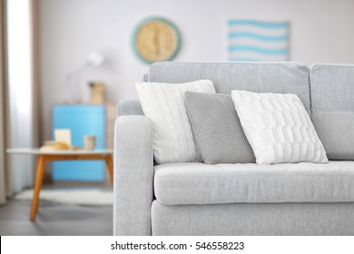 New Cozy Couch With Pillows In Modern Room Interior