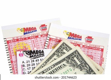 New Cumberland, PA, USA - April 13, 2012 : Mega Millions Lottery Game Pieces With A Ticket And Cash 