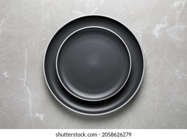 New Dark Plates On Light Grey Table, Top View