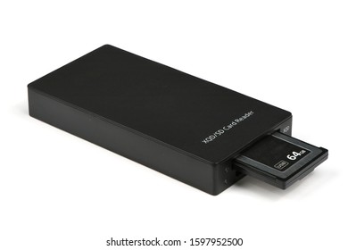 New data memory card and reader used in video photo products for high speed storage of content on white background. High resolution photo. Full depth of field.