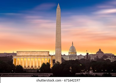 New dawn over Washington - with 3 iconic monuments illuminated at sunrise: Lincoln Memorial, Washington Monument and the Capitol Building. - Shutterstock ID 671642197