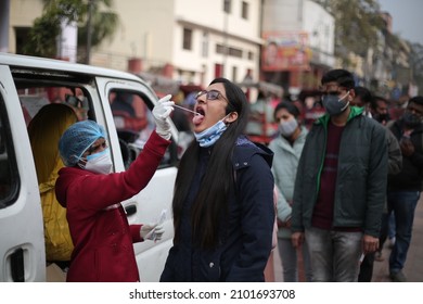 New Delhi, India - 01-06-2022 - A Health Worker Collects A Swab Sample For Covid-19 Testing At Chandni Chowk, Old Delhi, India.