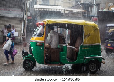 New Delhi / India - 07 20 2018: Heavy Rainfall In Delhi Causes Floods That Is A Problem For Transportation As Auto Rickshaws.