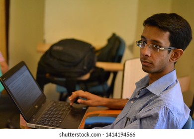 New Delhi, Delhi, India - 09/05/2014 : A Student Prepares For An Exam While Studying On His Laptop.