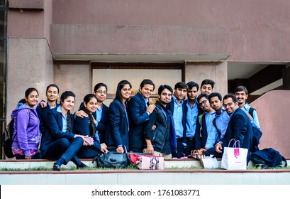 New Delhi, Delhi, India - 12/05/2014: A Large Group Of Students Celebrating Birthday With Cake And Candles At University Campus. College Kids Enjoying Outdoors On A Sunny Day.