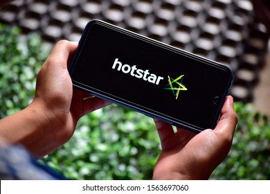 New Delhi, India - 18 November, 2019: Perso Using Hotstar Application On Smartphone