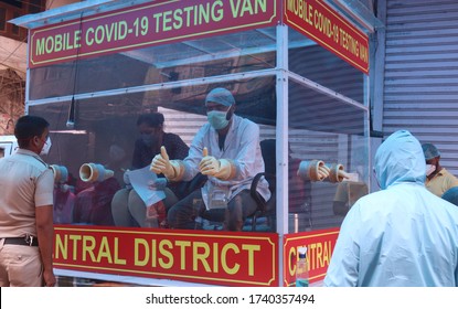 NEW DELHI, INDIA - APRIL 20, 2020: A Health Worker Wearing Mask And Safety Gears Before Test For Covid 19 Suspects, At Old Delhi Chandani Mahal, Red Zone, Covid-19, Coronavirus, Containment Zone