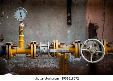 New Delhi, India- April 6 2021: CNG gas pipeline and meter with Iron Wheel Knob