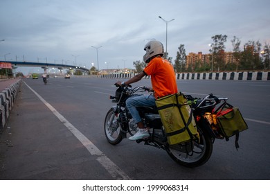 New Delhi, India- April 9 2021: A BigBasket Delivery Boy With Food Order Going For Delivery, Amid Covid  Lockdown In India, Emergency Services During Pandemic.