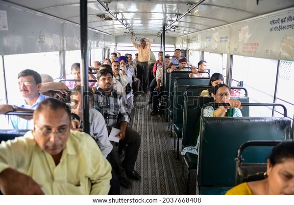 New\
Delhi, India- Aug 23 2019: passengers travelling in bus, public\
transport City bus extensive intercity and regional bus service\
network operated by DTC in Delhi. inside view of\
bus
