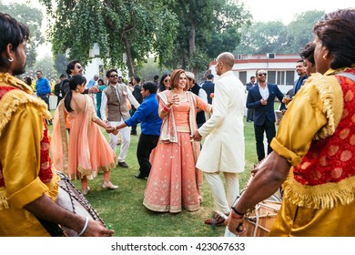 NEW DELHI, INDIA - December 8, 2015: Groom And Bride Dancing At The Indian Wedding Banquet