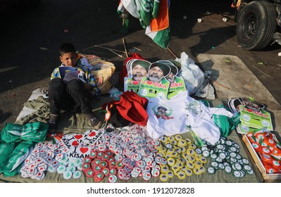 New Delhi, India, Feb 08, 2020: A Child Selling Sticker And Badges No Farmer No Food During Indian Farmers Protest Against BJP Government New Three Farm Laws At Ghazipur 