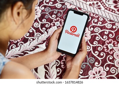 New Delhi, India - February 05, 2020: Girl Using Pinterest On Mobile Device