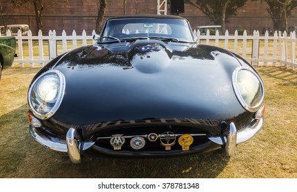 New Delhi, India - February 6, 2016: Black Jaguar E-Type Series 1 (1961) convertible on display at the 21 Gun Salute International Vintage Car Concours Show at Red Fort, New Delhi, India