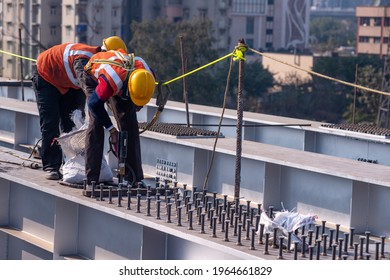 New Delhi, India, January 13 2020:  Operators Using Stud Welding Machine While Bridge Arch Construction.