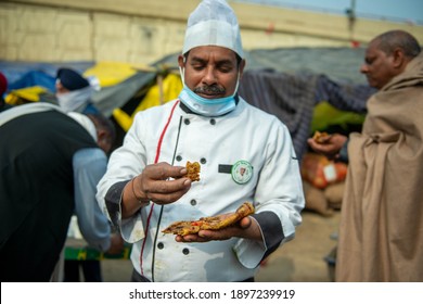 New Delhi, India, January 18 2020: Chef Eating Aloo Paratha During Farmers Agitation At Ghazipur Border.