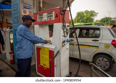New Delhi, India- June 11 2021: Customers pay after filling their vehicles with compressed natural gas, CNG pump station in New Delhi,
