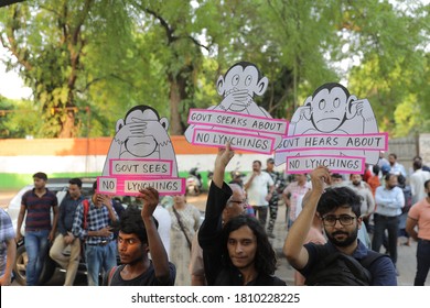 New Delhi, India - June 26, 2019 - A group of people hold pla-cards during a protest against mob lynching , in New Delhi.