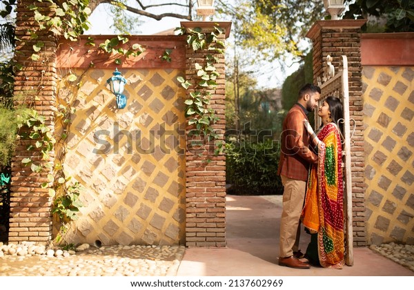New Delhi, India - March 01 2022: Pre wedding\
shoot of a young Indian couple having fun at Photo Paradise studio\
in Delhi, India. Upcoming big fat Indian wedding in Delhi in India.\
Traditional Couple.