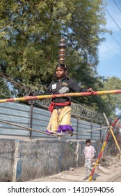 New Delhi, India - March 16 2019: A Girl Walking On Tight Rope In City Street.