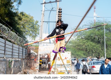 New Delhi, India - March 16 2019: A Girl Walking On Tight Rope In City Street.