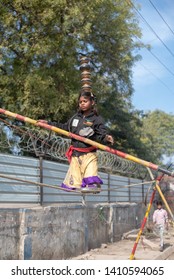 New Delhi, India - March 16 2019: A Girl Walking On Tight Rope In City Street.