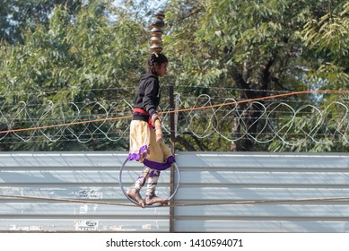 New Delhi, India - March 16 2019: A Girl Walking On Tight Rope In City Street.